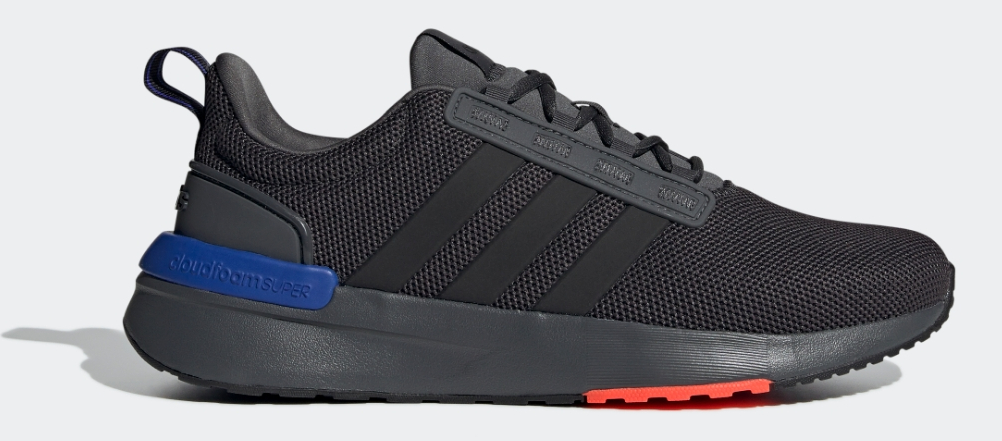 Black adidas shoe with blue and red accents on the sole