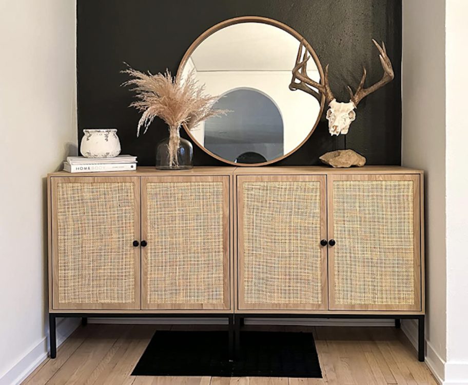 Kane table in the corner with a black wall and decoration