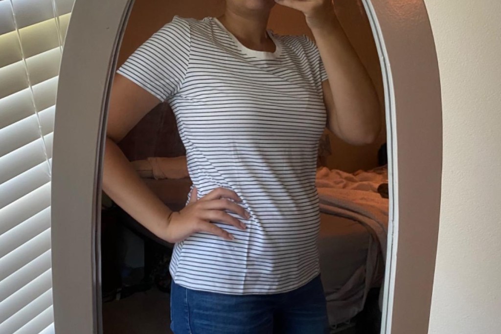 woman wearing striped t-shirt taking selfie