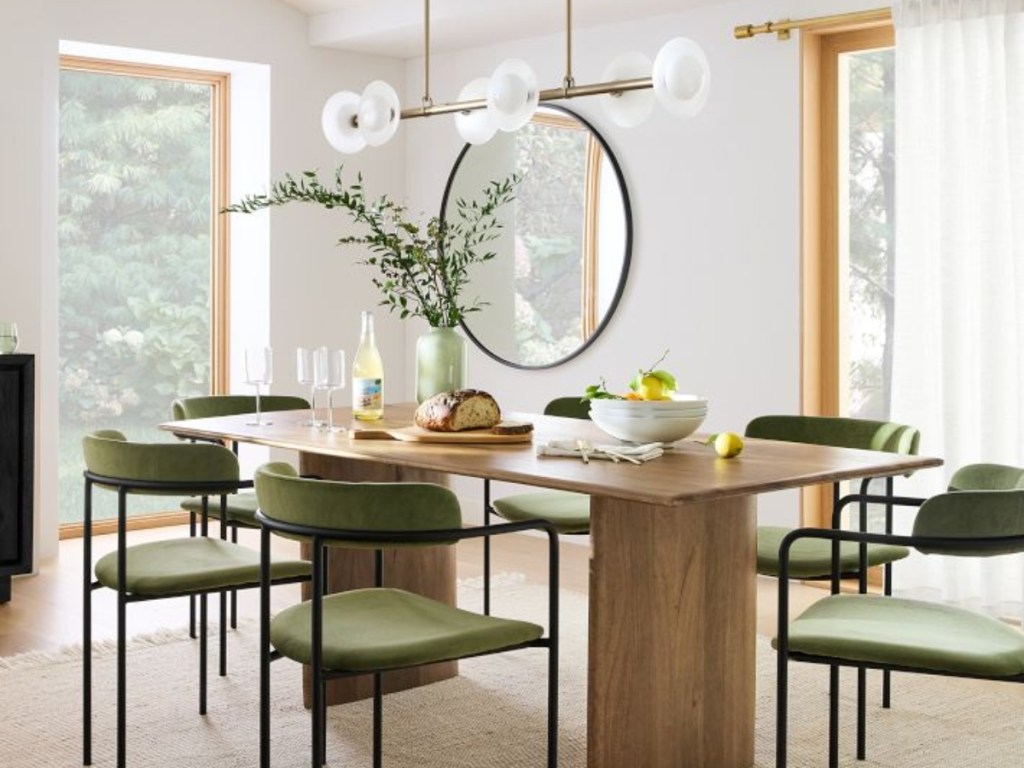 mid-century modern dining room set with green chairs
