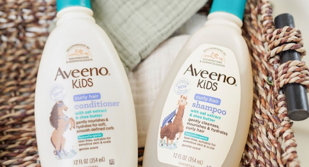 aveeno kids hair products in a basket with sheets on it
