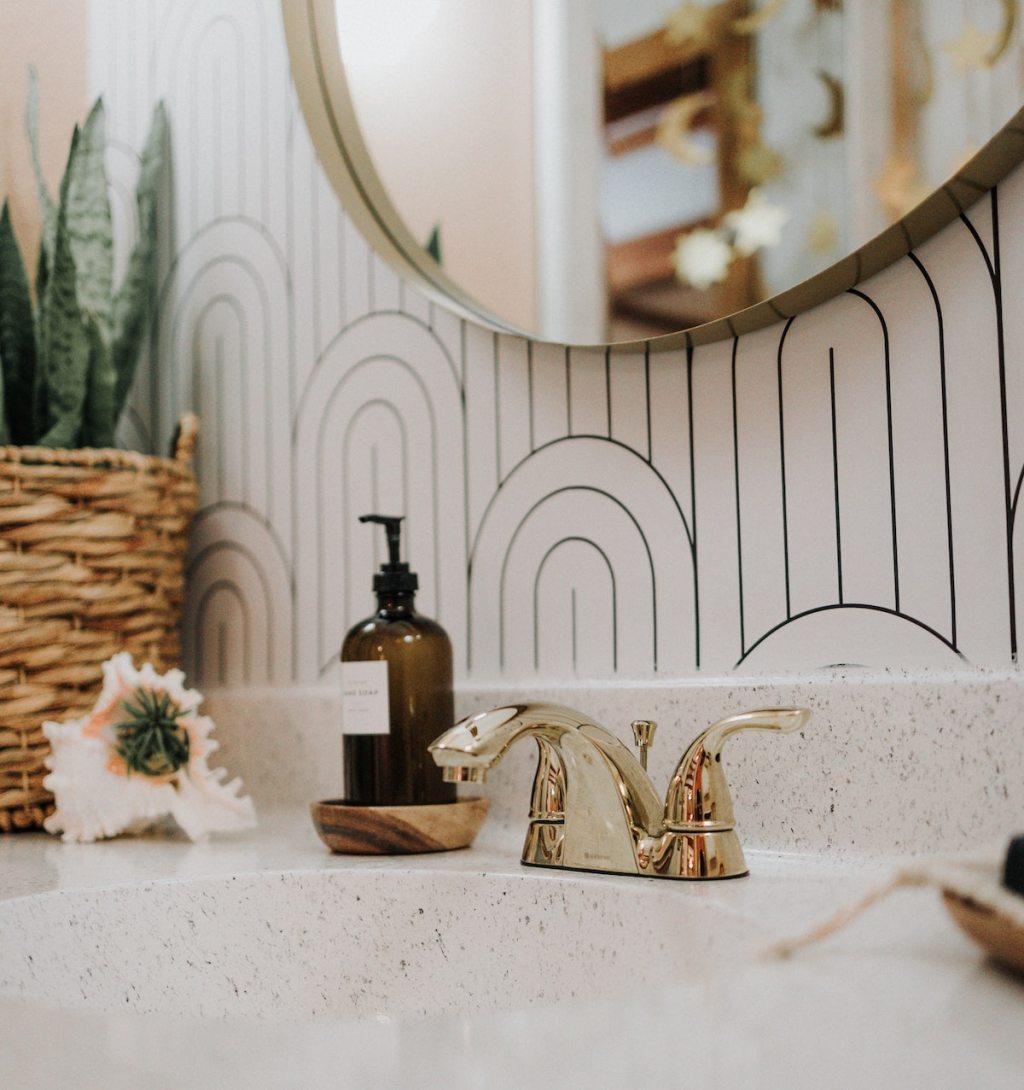 close up of bathroom vanity with airbnb essentials