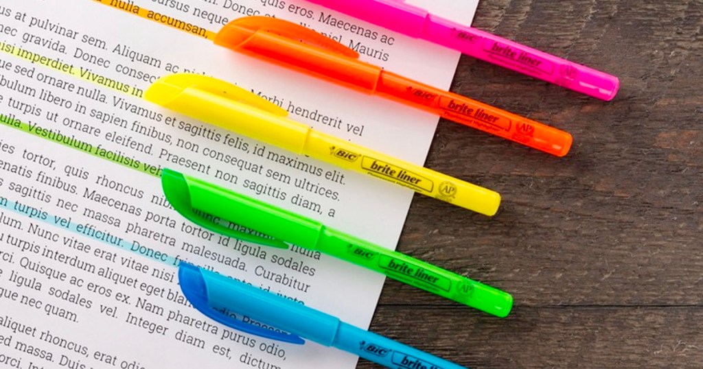 5 bic highlighters on book with words highlighted