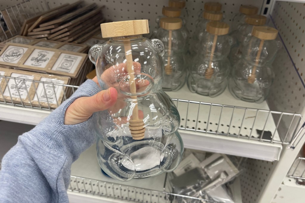 hand holding bear shaped jar
