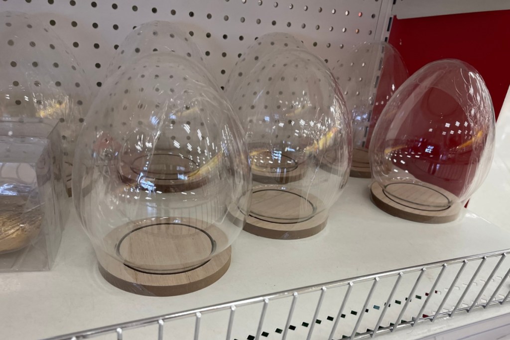 glass egg with wooden lid on target shelf