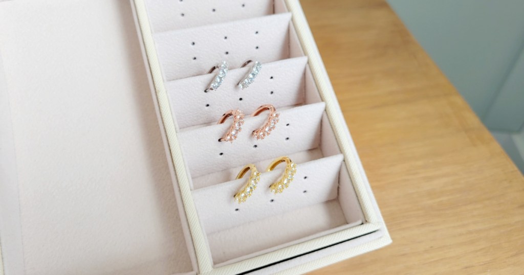 yellow, rose, and white gold small hoop earrings in jewelry box