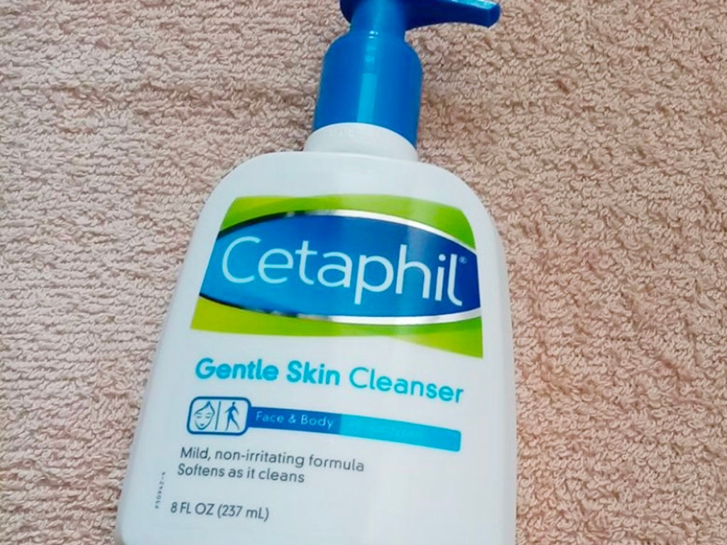 cetaphil skin cleanser laying on carpet