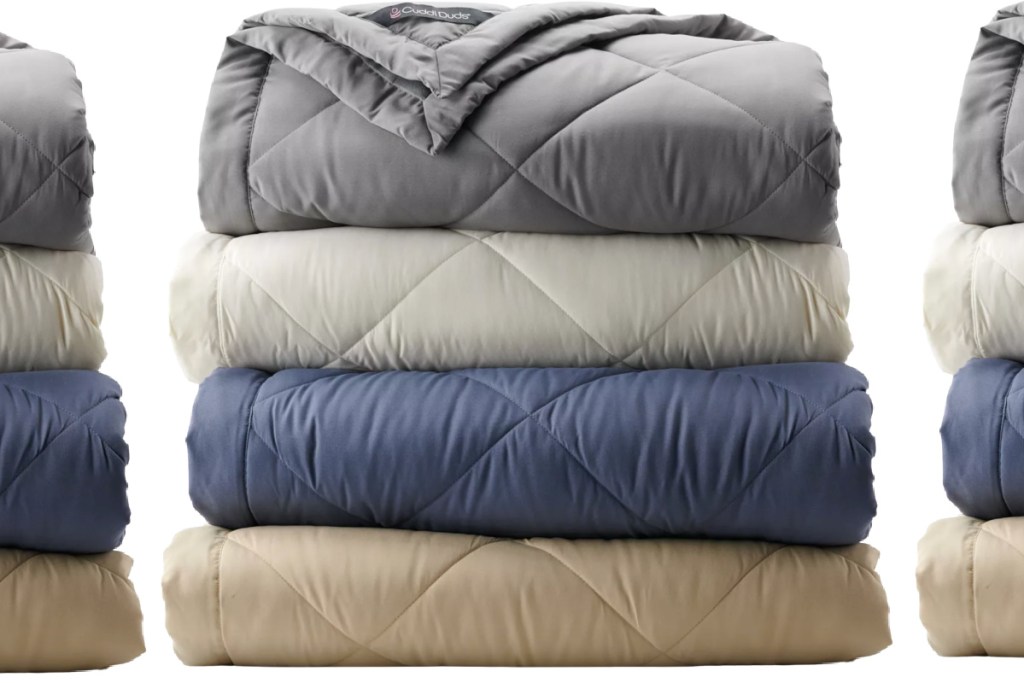 many comforters in a stack