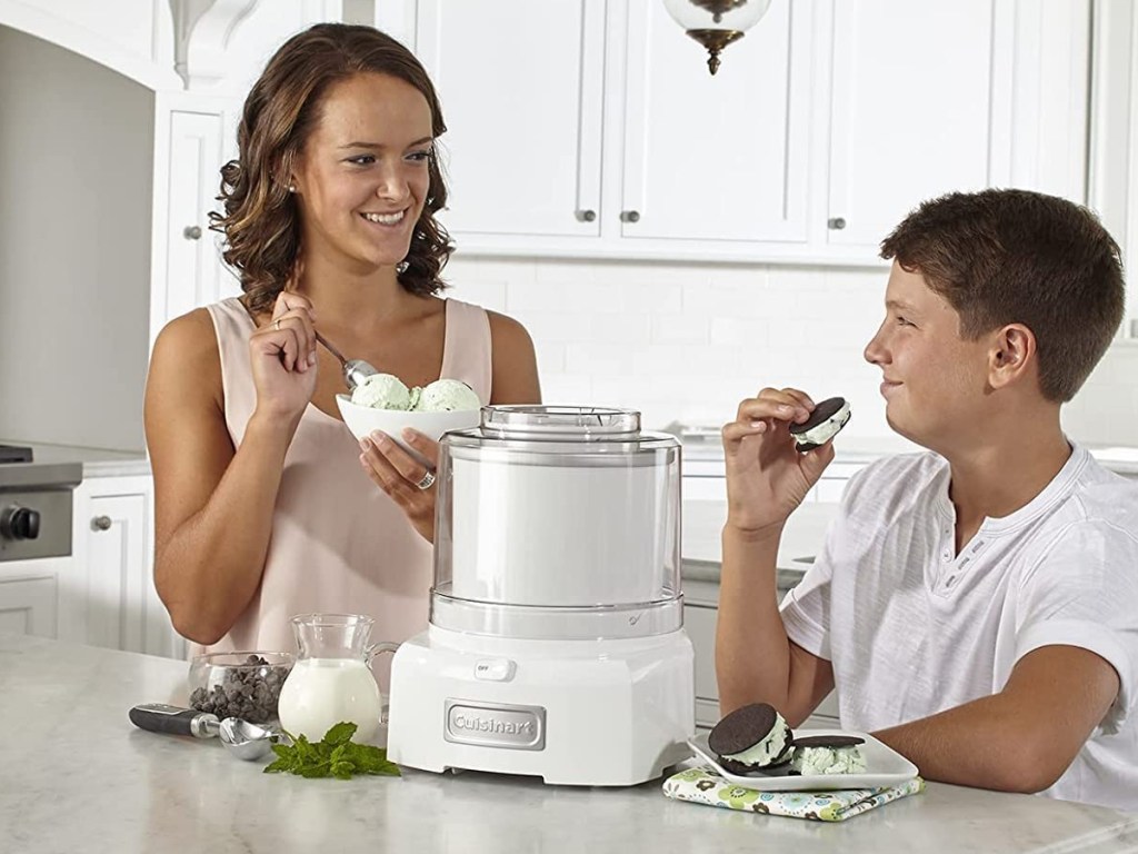 woman and child eating ice cream from ice cream maker