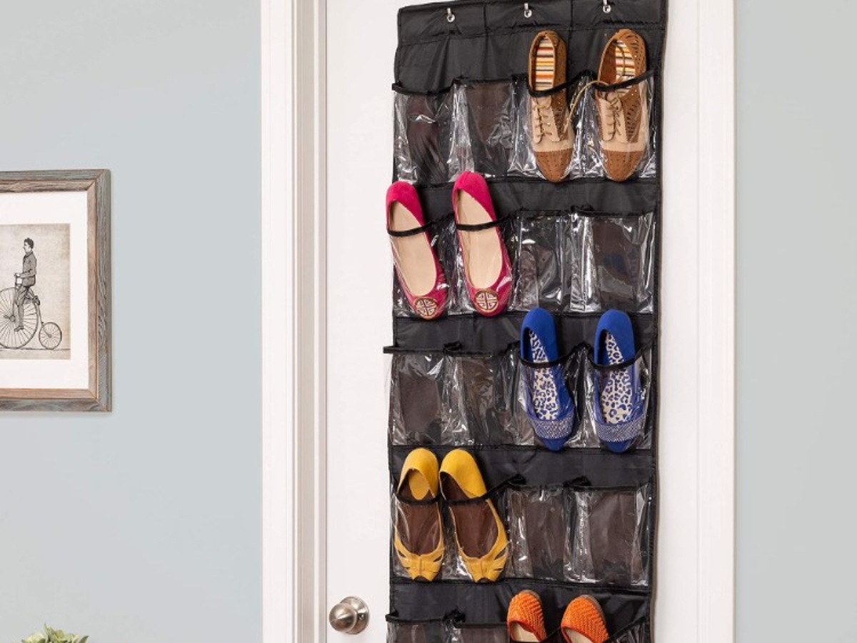 Black door organizer with shoes in it.