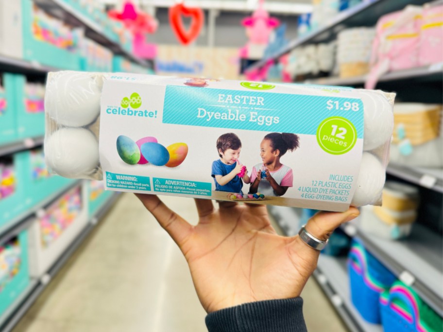 hand holding dyeable eggs in store