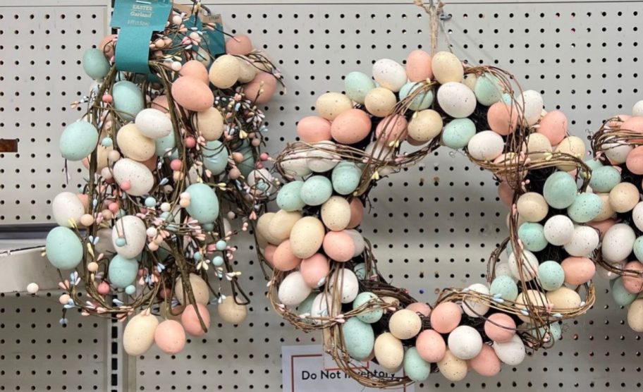 easter egg garland and easter egg wreath in pastel colors on a store display