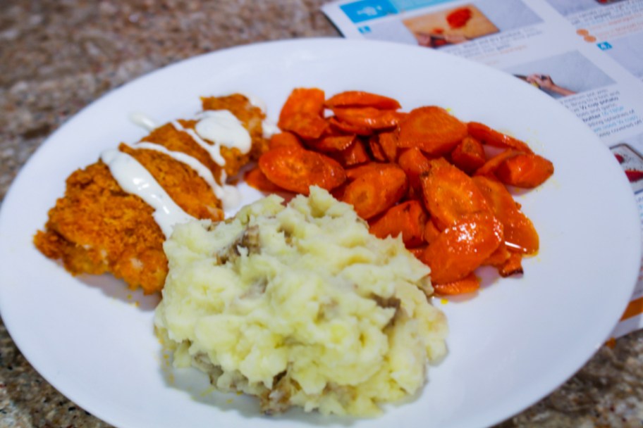 chicken mashed potatoes and carrots on plate