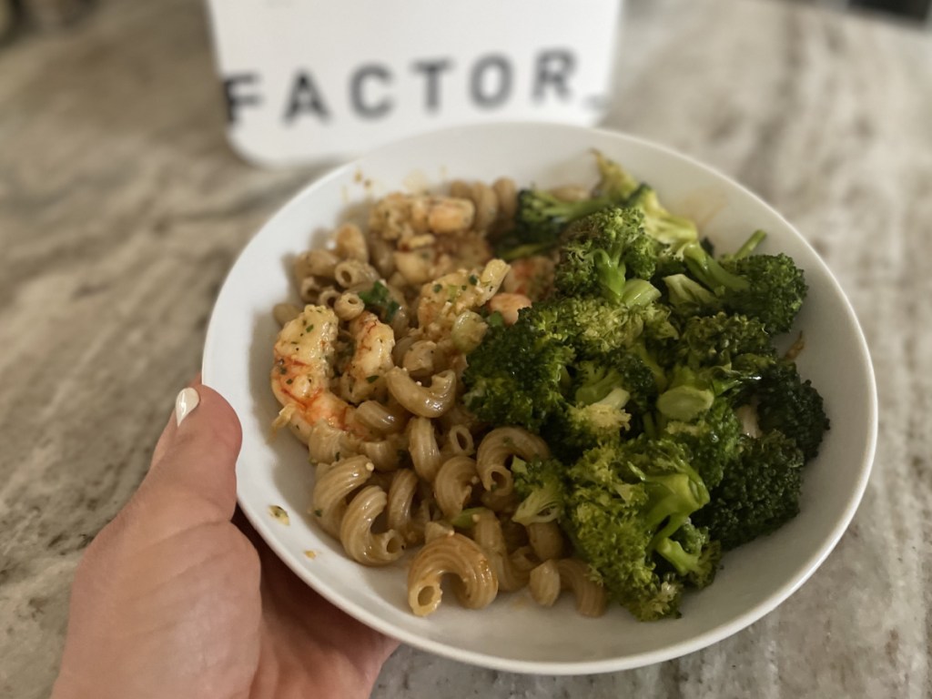 pasta and veggies in front of factor box