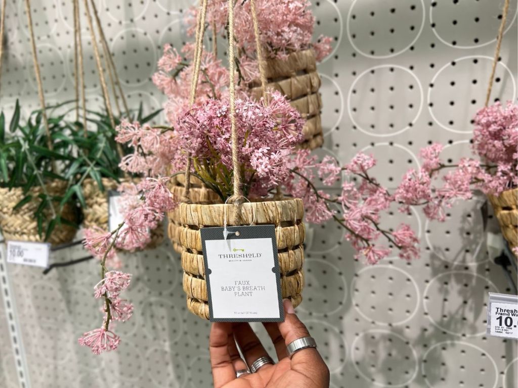 Threshold Faux Baby's Breath plant haging on wall in store