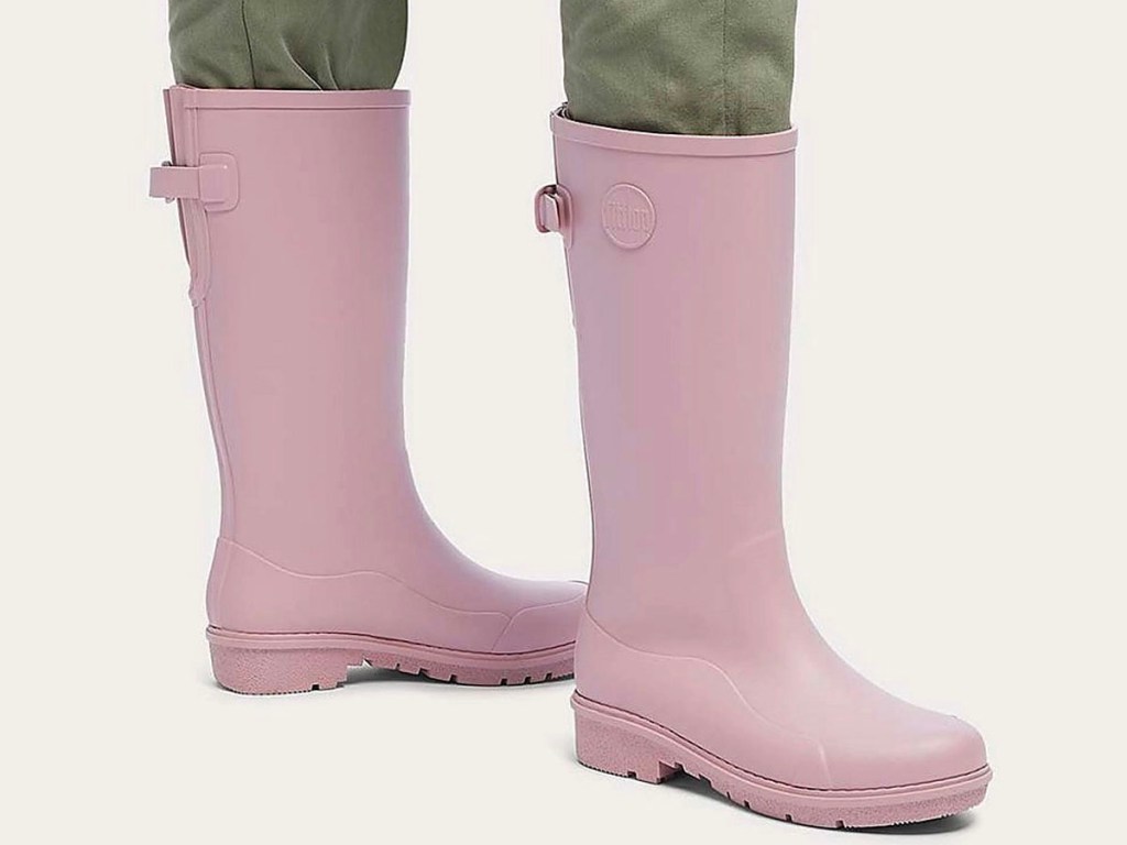 woman wearing pink tall rainboots
