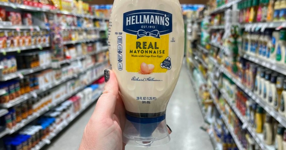 hand holding hellmann's mayonnaise in publix store