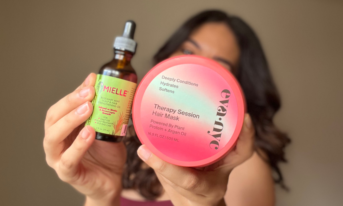 holding mielle scalp oil and eva nyc therapy session hair mask