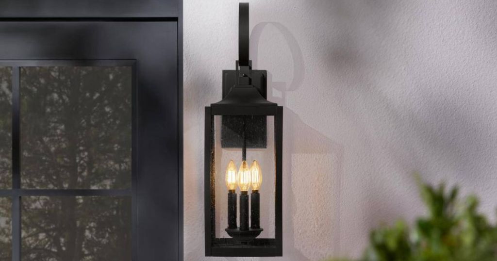 black sconce on wall on porch