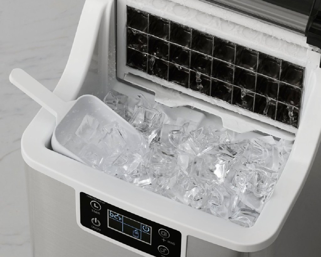 scoop inside ice maker with clear ice