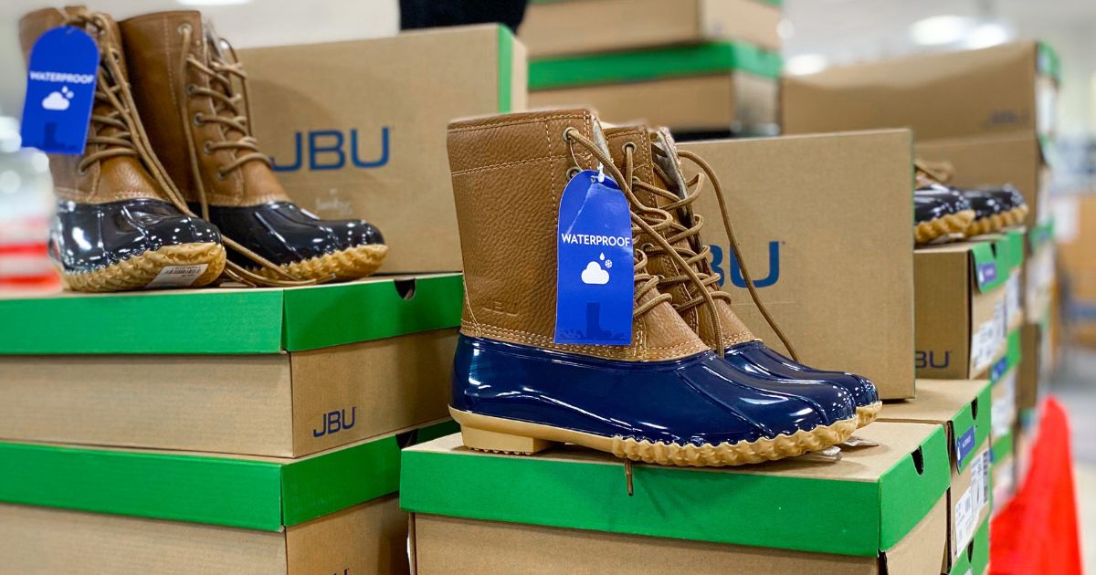 jbu brown and navy duck boots on display table