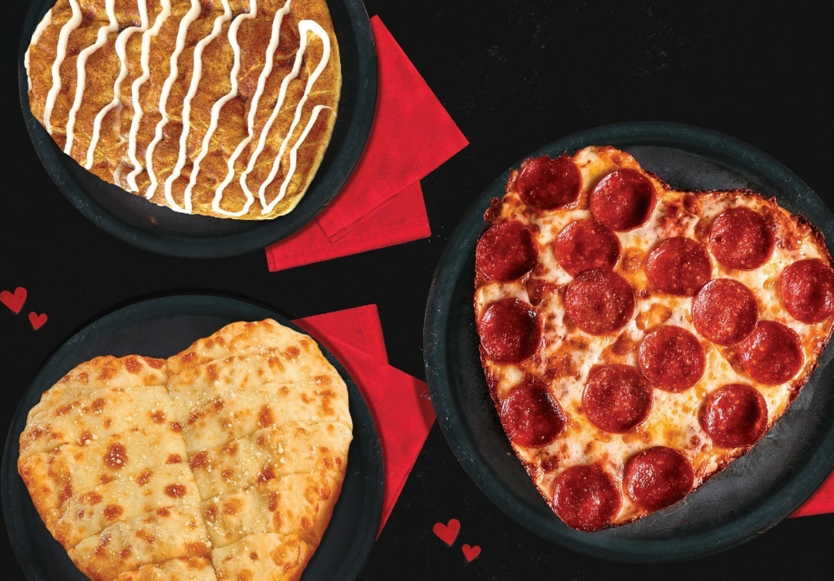 3 heart-shaped pizzas from Jet's Pizza with various toppings