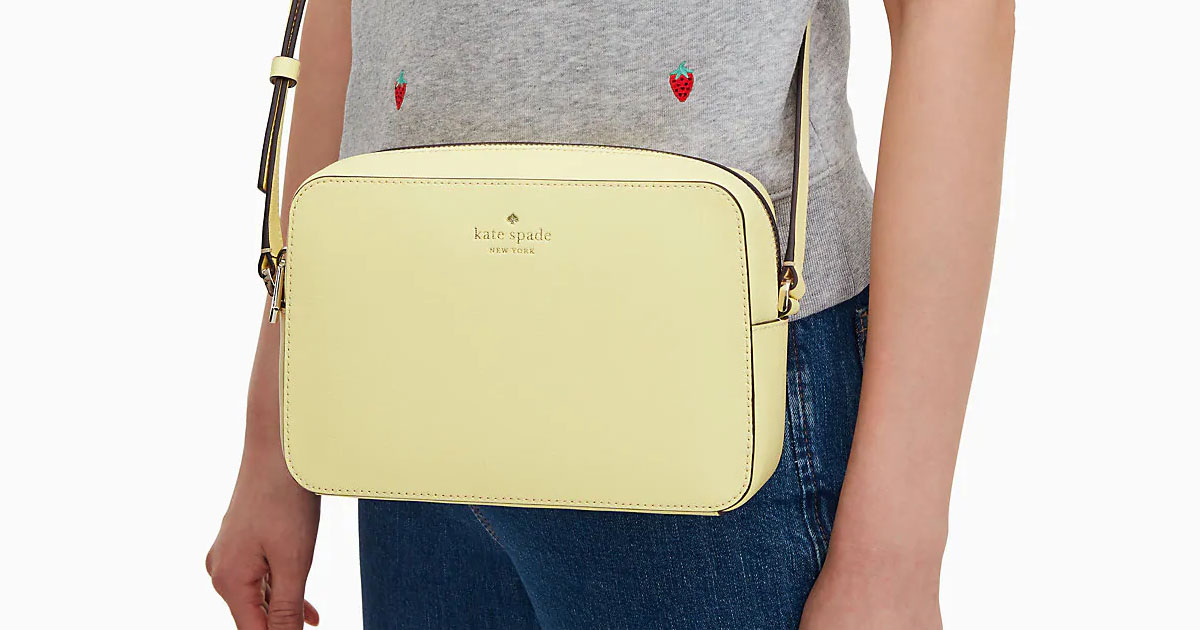 woman with yellow kate spade crossbody across chest