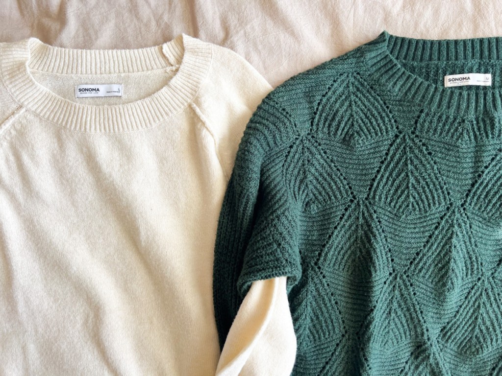 white and green sweaters with linked arms