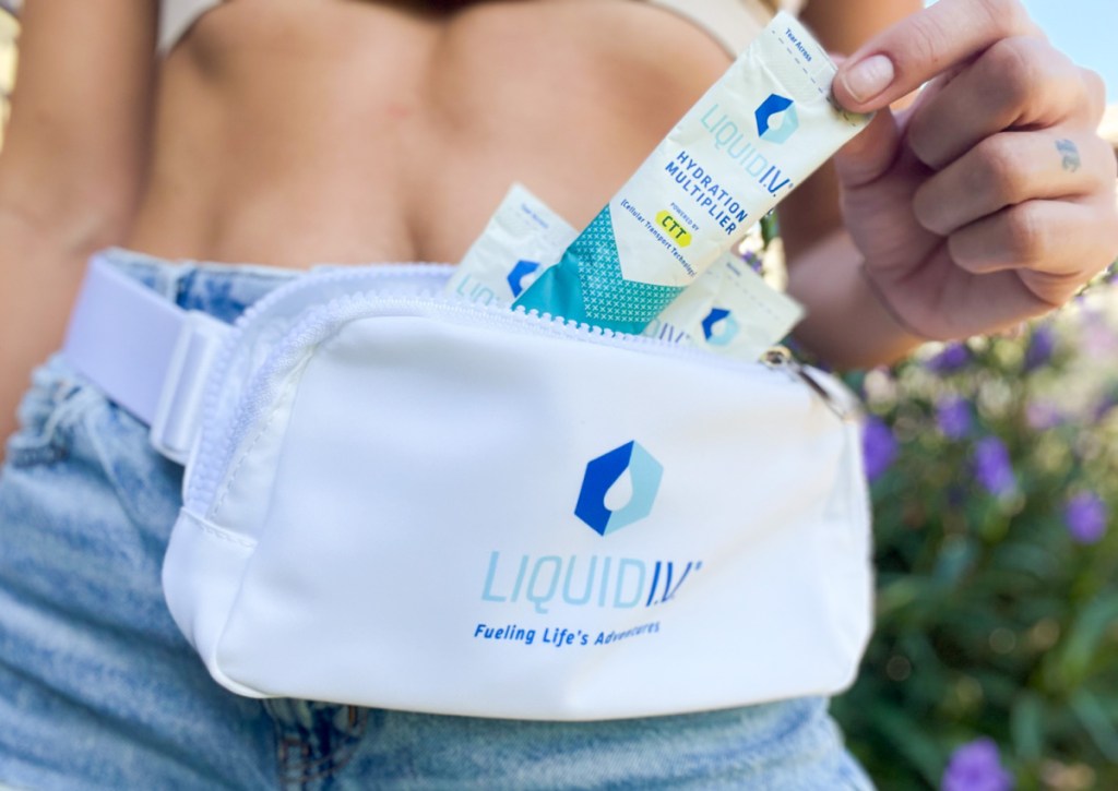 pulling liquid iv stick out of fanny pack