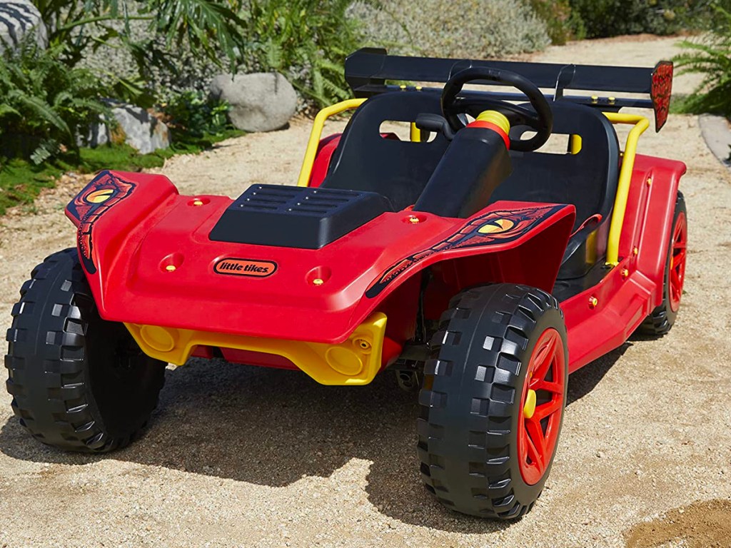 red little tikes dune buggy sitting outside