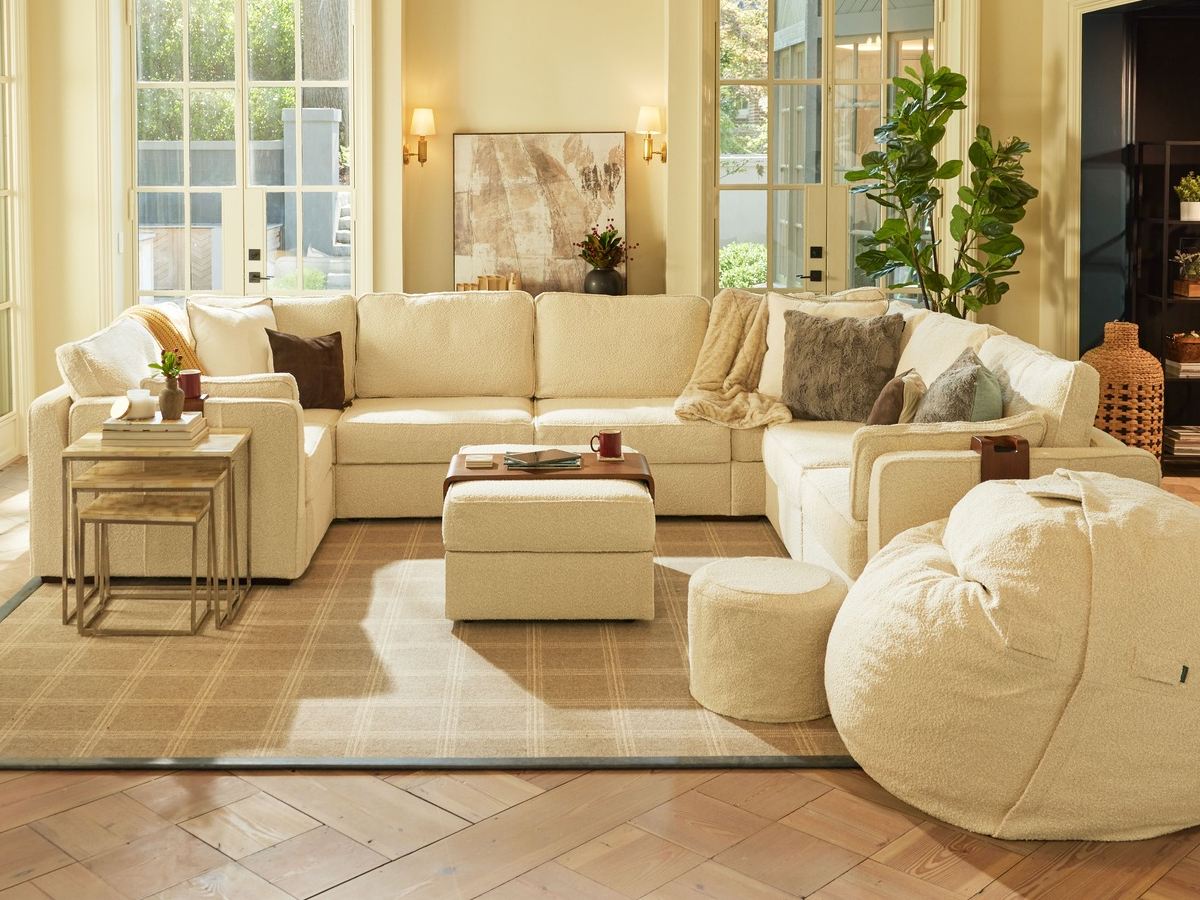 living room with beige sectional and Lovesac