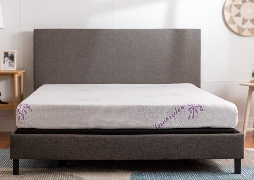 bare mattress on fabric bedframe