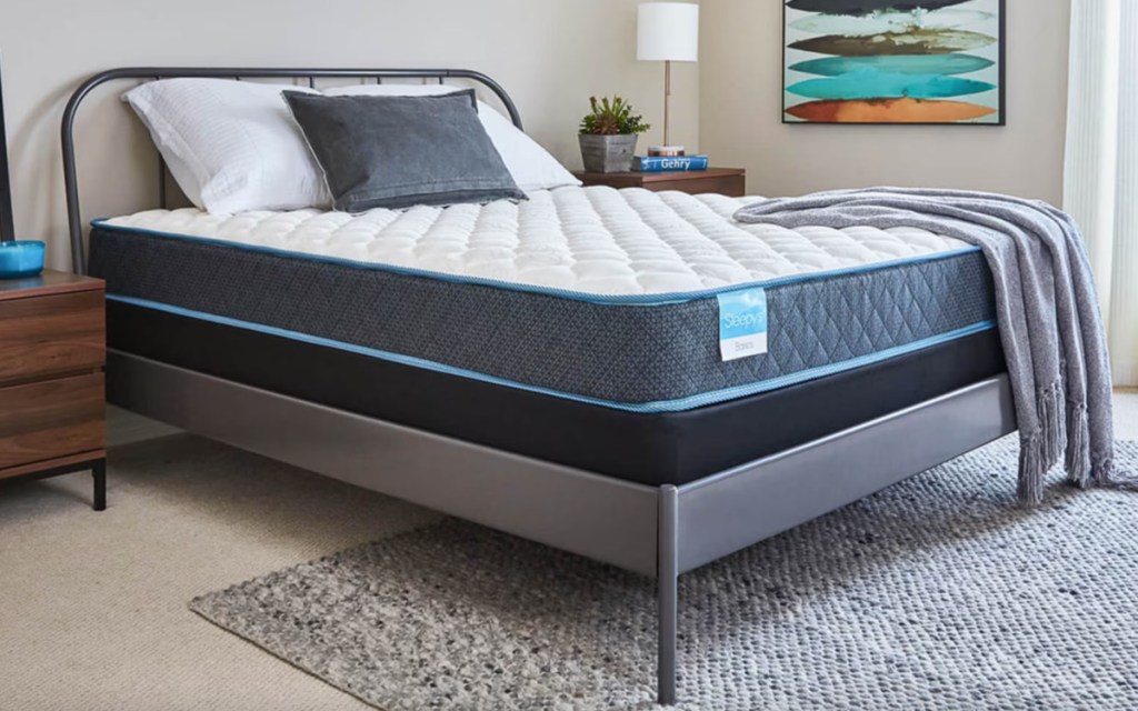 sleepys mattress on bed frame in bedroom