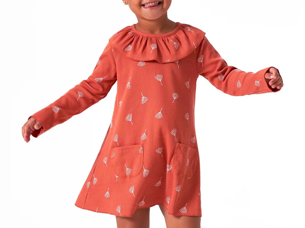 toddler girl wearing orange floral dress