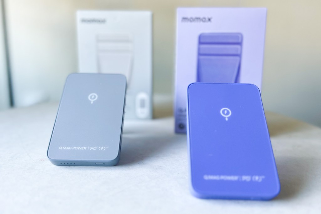 grey and purple power banks next to boxes