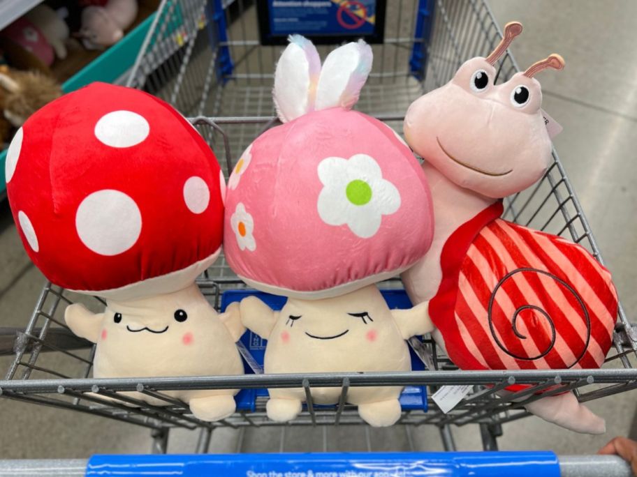 mushroom, bunny and snail plush easter basket fillers in a shopping cart