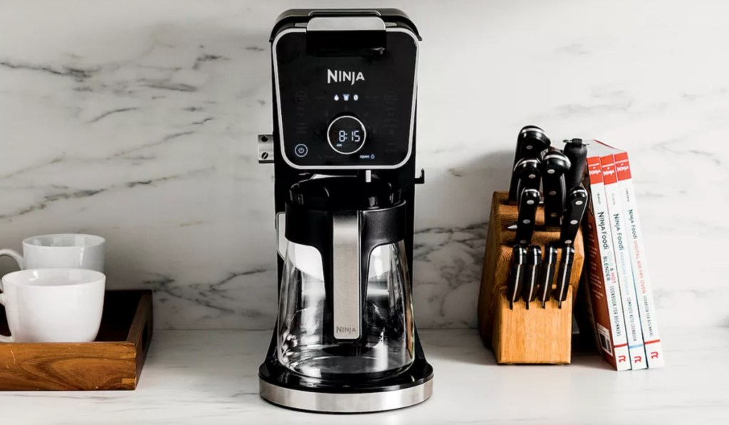 coffee maker next to knife block on counter