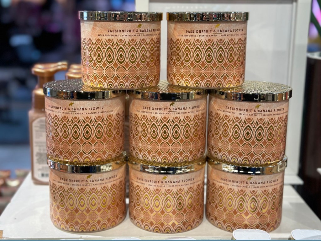 passionfruit & banana flower 3 wick candles stacked in store