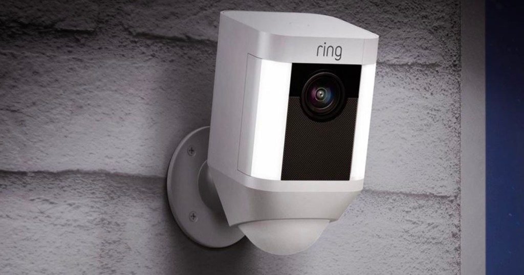 ring spotlight wireless camera hanging on wall