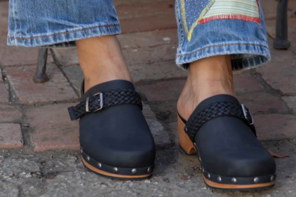 black clogs with patwork jeans