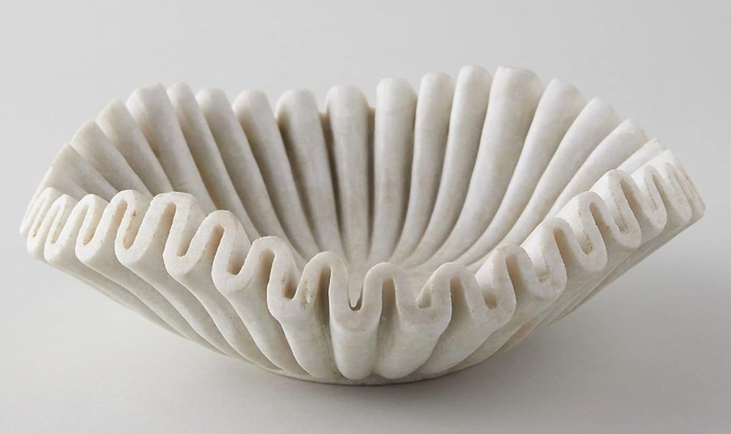 Stock photo of white marble ruffled bowl