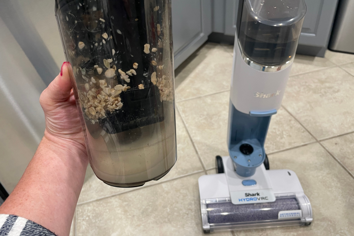 shark filter filled with oatmeal and other waste from vacuum mopping