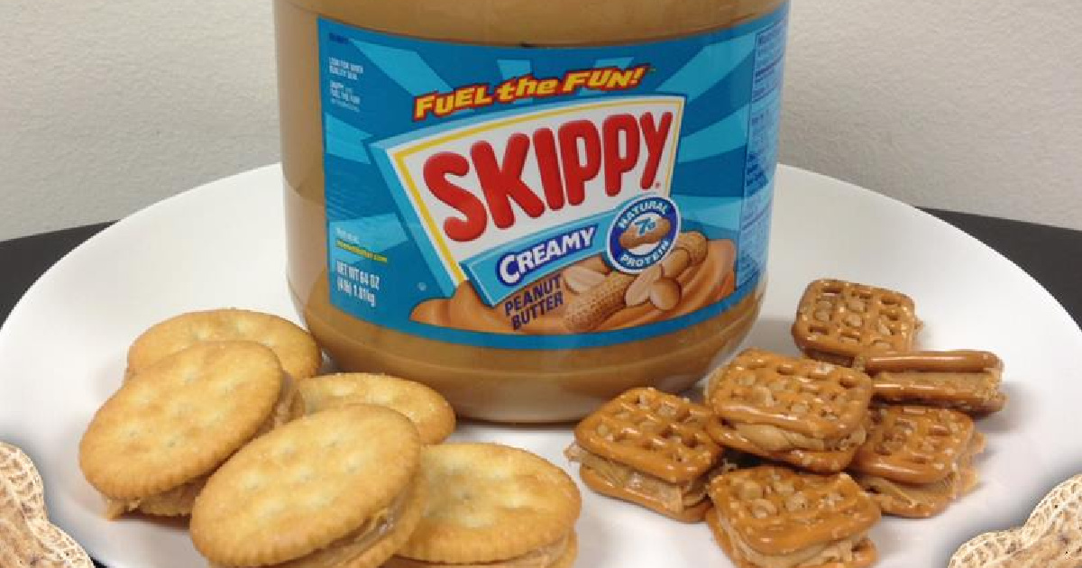 skippy peanut butter on a plate with crackers and pretzels