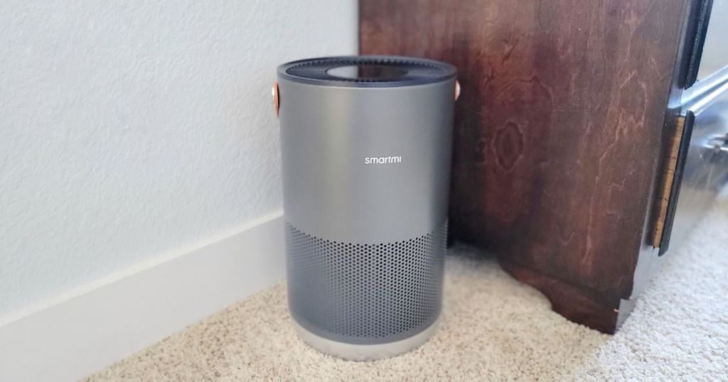 sliver smartmi air purifier on floor of room