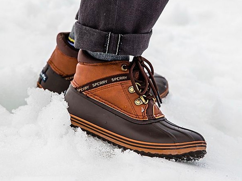 brown and black sperry boots in snow