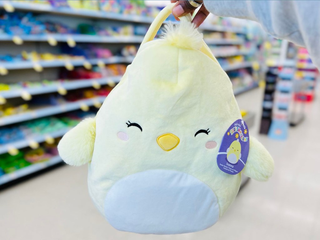 hand holding yellow chick squishmallow basket