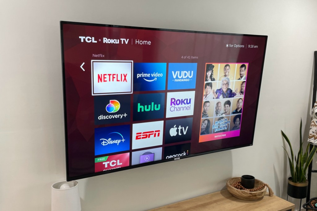 tcl roku TV mounted in living room