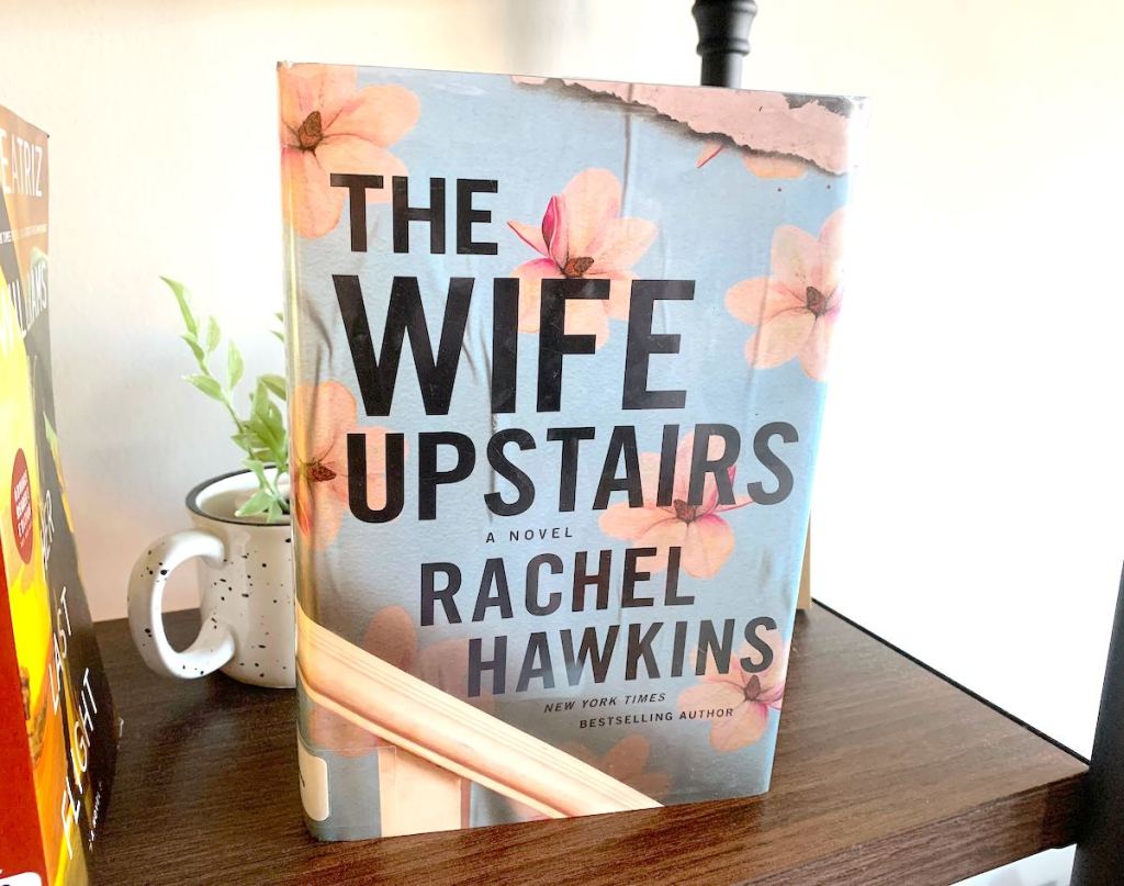 the wife upstairs book on bookshelf