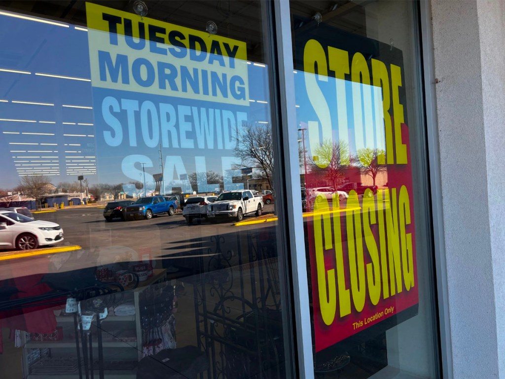 Tuesday morning window with store closing signs