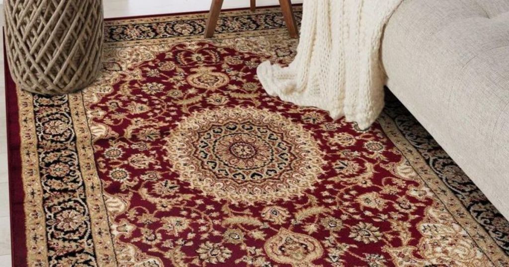 burgundy red patterned rug on living room floor